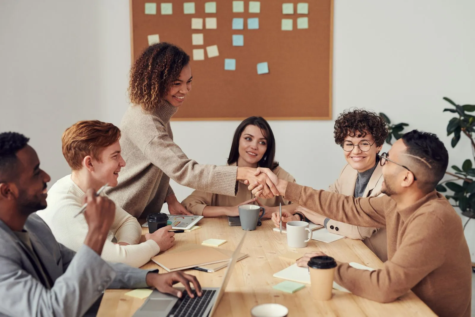 Specialists reviewing campaign performance around a shared desk